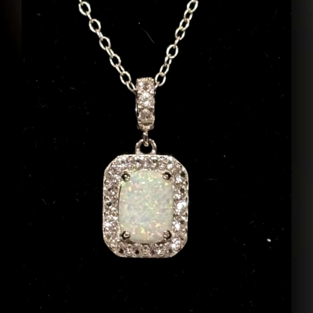 Sterling Silver 925 lab-created Opal and Topaz necklace. 18 inches in length.